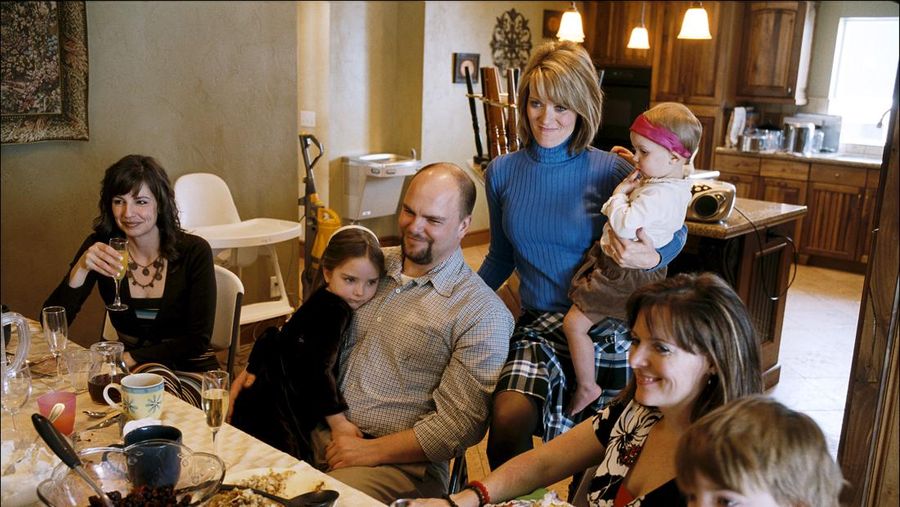 HERRIMAN, UTAH - FEBRUARY, 2008: Sunday brunch in a polygamist family consisting of one husband (Joe), three wives (from left to right: Allie, Valerie and Vicky), and 21 children. Sunday is one of the few days of the week when the entire family finds time to share a meal. This plural family lives in the Salt Lake Valley among monogamist families. (Photo by Stephan Gladieu/Getty Images)