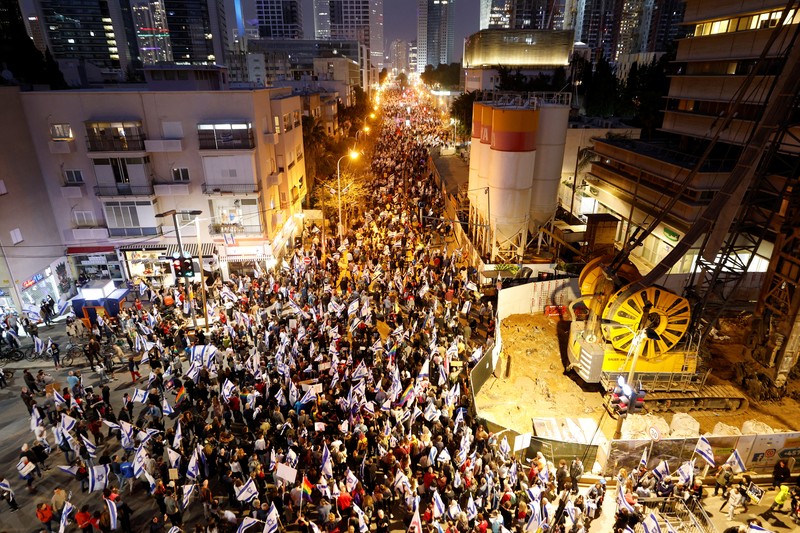 ISRAEL-POLITICS/JUDICIARY-PROTESTS People attend a demonstration, as Israeli Prime Minister Benjamin Netanyahu's nationalist coalition government presses on with its judicial overhaul, in Tel Aviv, Israel March 25, 2023. REUTERS/Amir Cohen