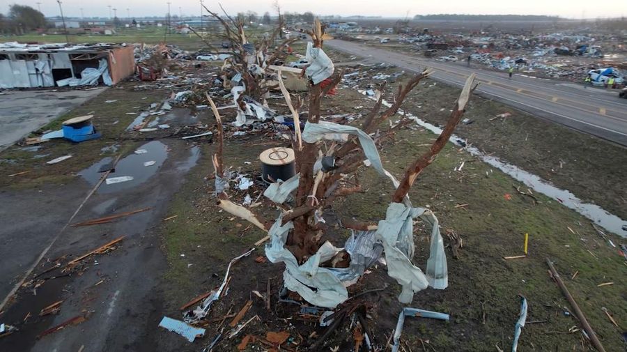 A vehicle is seen impaired by a piece of wood after thunderstorms spawning high straight-line winds and tornadoes ripped across the state, in Rolling Fork, Mississippi, U.S. March 26, 2023.  REUTERS/Cheney Orr
