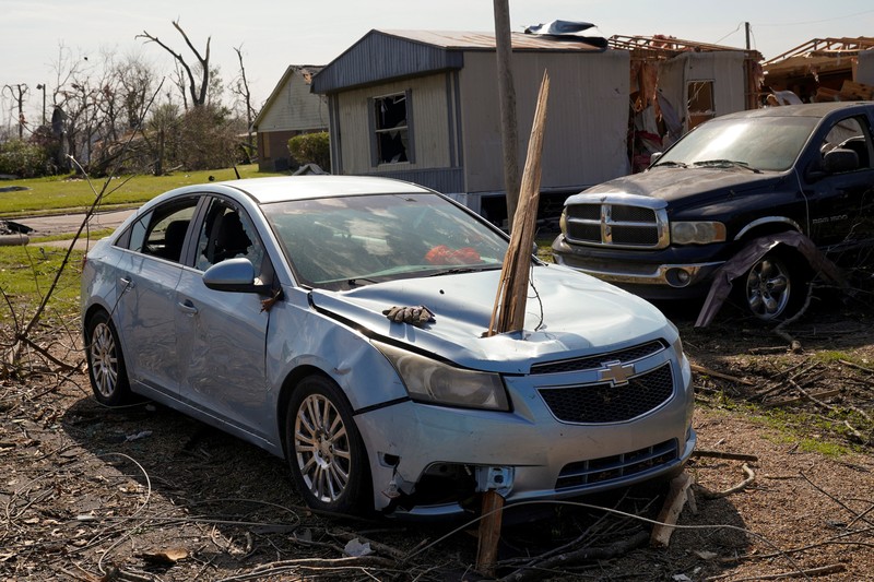 USA-WEATHER/MISSISSIPPI A vehicle is seen impaired by a piece of wood after thunderstorms spawning high straight-line winds and tornadoes ripped across the state, in Rolling Fork, Mississippi, U.S. March 26, 2023. REUTERS/Cheney Orr