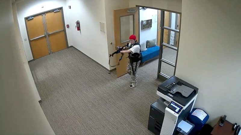 A still image from surveillance video shows what the Metropolitan Nashville Police Department describe as mass shooting suspect Audrey Elizabeth Hale, 28, entering The Covenant School carrying weapons in Nashville, Tennessee, U.S. March 27, 2023.  Metropolitan Nashville Police Department/Handout via REUTERS   THIS IMAGE HAS BEEN SUPPLIED BY A THIRD PARTY. NO RESALES. NO ARCHIVES