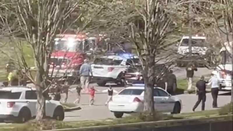 Children hold hands as they walk after a mass shooting at the Covenant School, in Nashville, Tennessee, U.S. March 27, 2023.   TMX / Jozen Reodica/Handout via REUTERS    THIS IMAGE HAS BEEN SUPPLIED BY A THIRD PARTY. NO RESALES. NO ARCHIVES. MANDATORY CREDIT