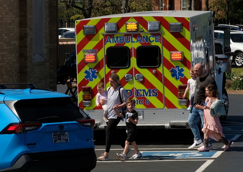 TENNESSEE-SHOOTING/ Children hold hands as they walk after a mass shooting at the Covenant School, in Nashville, Tennessee, U.S. March 27, 2023. TMX / Jozen Reodica/Handout via REUTERS THIS IMAGE HAS BEEN SUPPLIED BY A THIRD PARTY. NO RESALES. NO ARCHIVES. MANDATORY CREDIT