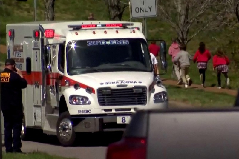 TENNESSEE-SHOOTING/ Children hold hands as they walk after a mass shooting at the Covenant School, in Nashville, Tennessee, U.S. March 27, 2023. TMX / Jozen Reodica/Handout via REUTERS THIS IMAGE HAS BEEN SUPPLIED BY A THIRD PARTY. NO RESALES. NO ARCHIVES. MANDATORY CREDIT