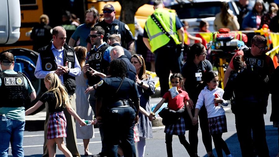Children hold hands as they walk after a mass shooting at the Covenant School, in Nashville, Tennessee, U.S. March 27, 2023.   TMX / Jozen Reodica/Handout via REUTERS    THIS IMAGE HAS BEEN SUPPLIED BY A THIRD PARTY. NO RESALES. NO ARCHIVES. MANDATORY CREDIT