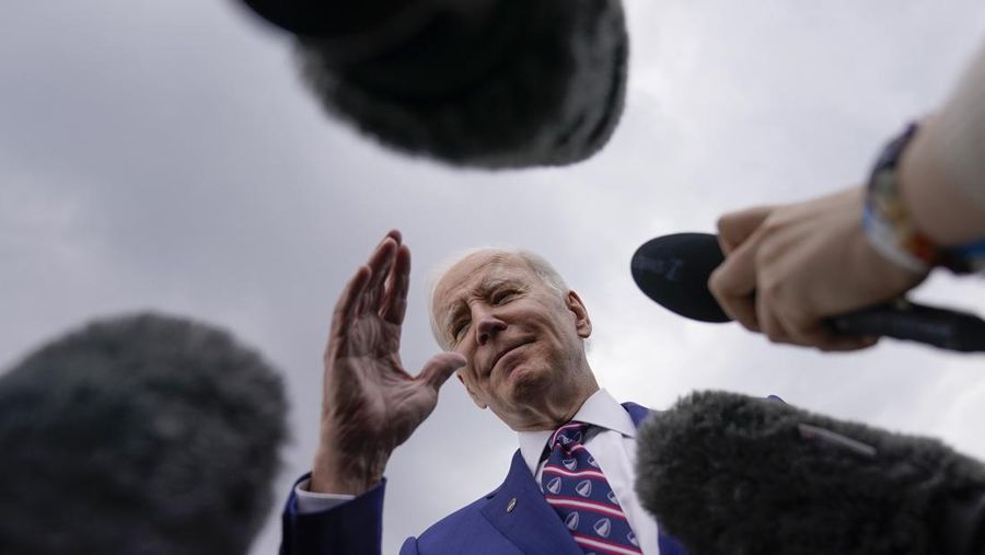 President Joe Biden talks with reporters be he boards Air Force One at Raleigh-Durham International Airport in Morrisville, N.C., Tuesday, March 28, 2023, en route to Washington. (AP Photo/Carolyn Kaster)