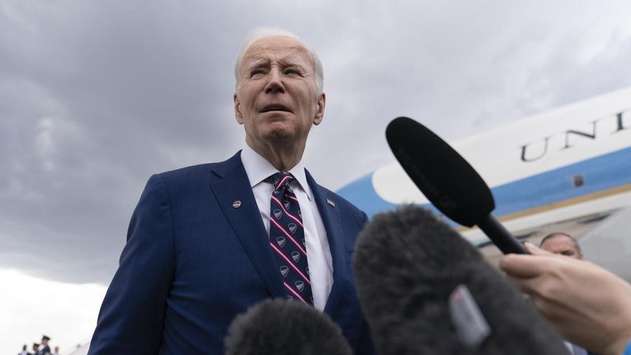 President Joe Biden speaks to reporters before boarding Air Force One at Raleigh-Durham International Airport in Morrisville, N.C., Tuesday, March 28, 2023, en route to Washington. (AP Photo/Carolyn Kaster)