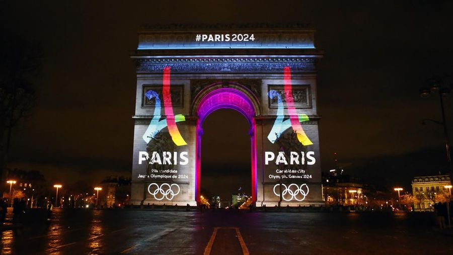 FILE - A Tuesday, Feb. 9, 2016 photo from files showing the Eiffel Tower-shaped logo for the Paris 2024 bid being unveiled on The Arc of Triomphe on the Champs Elysees in Paris. The head of France's Olympic committee said Wednesday, April 27, 2016, that hosting a successful European Championship in June and July would provide further proof that the country could stage the games safely in 2024. (AP Photo/Francois Mori, File)