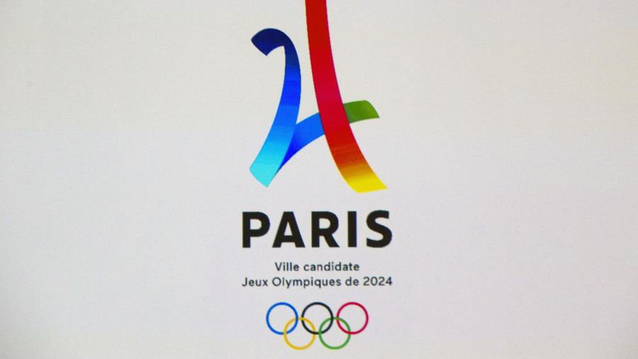 The Eiffel Tower-shaped bid logo for the Paris 2024 is projected on a screen during the official presentation of Paris as candidate for the 2024 Olympic summer games in Paris, France, Wednesday, Feb. 17, 2016. Paris, which hosted the Olympics in 1900 and 1924, is competing against Budapest, Rome and Los Angeles for the games. The International Olympic Committee will choose the host city in September 2017. (AP Photo/Francois Mori)