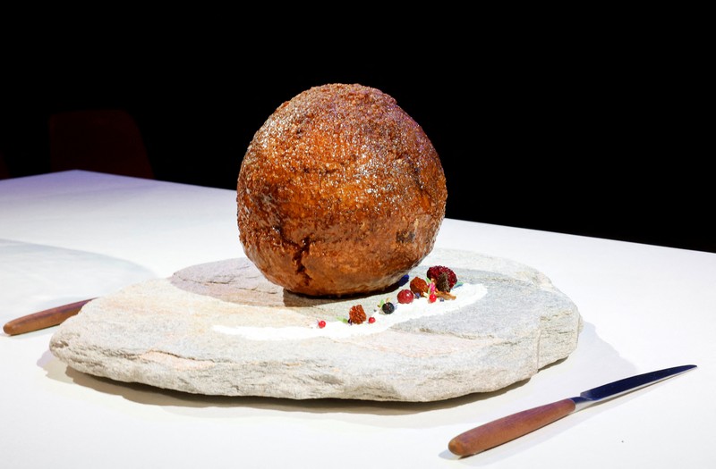 NETHERLANDS-MAMMOTH/ A meatball made from flesh cultivated using the DNA of an extinct woolly mammoth is presented at NEMO Science Museum created by a cultured meat company, in Amsterdam, Netherlands March 28, 2023. REUTERS/Piroschka van de Wouw