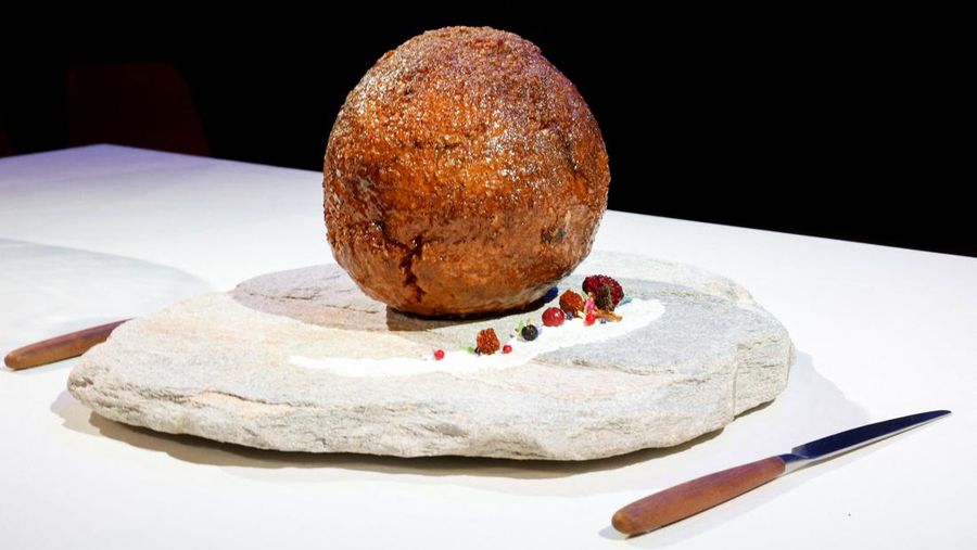 A meatball made from flesh cultivated using the DNA of an extinct woolly mammoth is presented at NEMO Science Museum created by a cultured meat company, in Amsterdam, Netherlands March 28, 2023. REUTERS/Piroschka van de Wouw