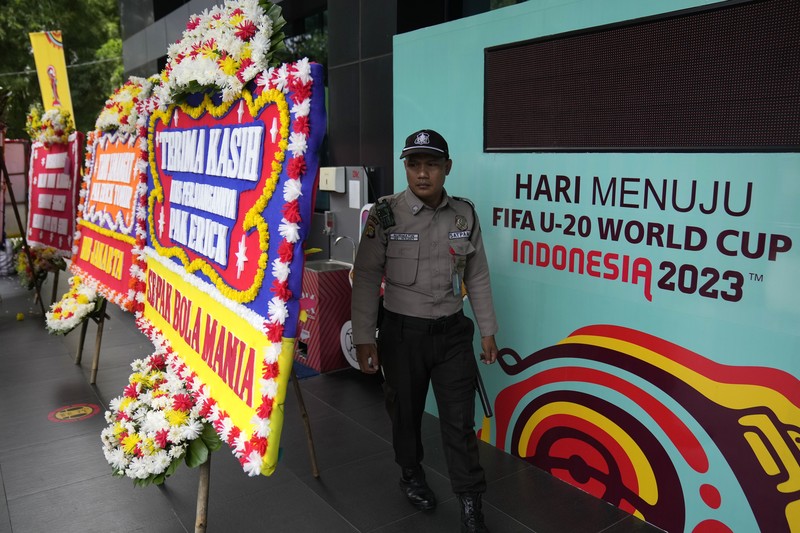 1249921067 This picture shows wreaths expressing the concern of football fans outside the office of the Indonesian football association in Jakarta on March 30, 2023. - FIFA announced on March 29 it had removed Indonesia as hosts of this year's under-20 World Cup amid political turmoil over Israel's participation. (Photo by BAY ISMOYO / AFP) (Photo by BAY ISMOYO/AFP via Getty Images)