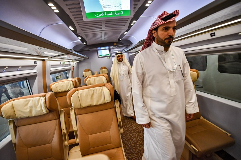 This picture taken on December 12, 2019 shows a view of a Haramain High Speed train, part of a network linking Saudi Arabia's two Muslim holy cities of Mecca and Medina, while at the airport station in the Red Sea city of Jeddah. - The high-speed railway, inaugurated by King Salman in September 2018, runs 450 kilometres (280 miles) via the Red Sea port of Jeddah, shuttling passengers at speeds of up to 300 kilometres per hour. Officials had described it as the biggest transport project in the region. Saudi is boosting its infrastructure spending and expanding its railways as it seeks to diversify its oil-dependent economy. (Photo by GIUSEPPE CACACE / AFP) (Photo by GIUSEPPE CACACE/AFP via Getty Images)