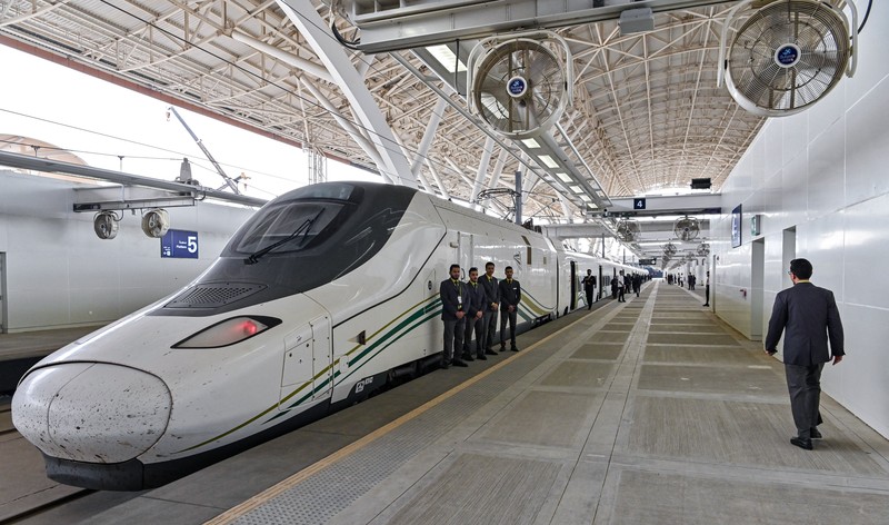 This picture taken on December 12, 2019 shows a view of a Haramain High Speed train, part of a network linking Saudi Arabia's two Muslim holy cities of Mecca and Medina, while at the airport station in the Red Sea city of Jeddah. - The high-speed railway, inaugurated by King Salman in September 2018, runs 450 kilometres (280 miles) via the Red Sea port of Jeddah, shuttling passengers at speeds of up to 300 kilometres per hour. Officials had described it as the biggest transport project in the region. Saudi is boosting its infrastructure spending and expanding its railways as it seeks to diversify its oil-dependent economy. (Photo by GIUSEPPE CACACE / AFP) (Photo by GIUSEPPE CACACE/AFP via Getty Images)