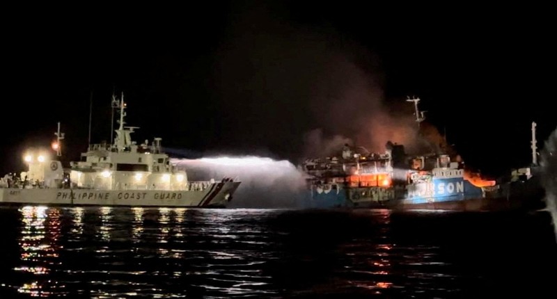 PHLIPPINES-SHIP/ Philippine Coast Guard respond to the fire incident onboard M/V LADY MARY JOY 3 at the waters off Baluk-Baluk Island, Hadji Muhtamad, Basilan, Philippines, March 29, 2023. Philippine Coast Guard/Handout via REUTERS THIS IMAGE HAS BEEN SUPPLIED BY A THIRD PARTY. NO RESALES. NO ARCHIVES.