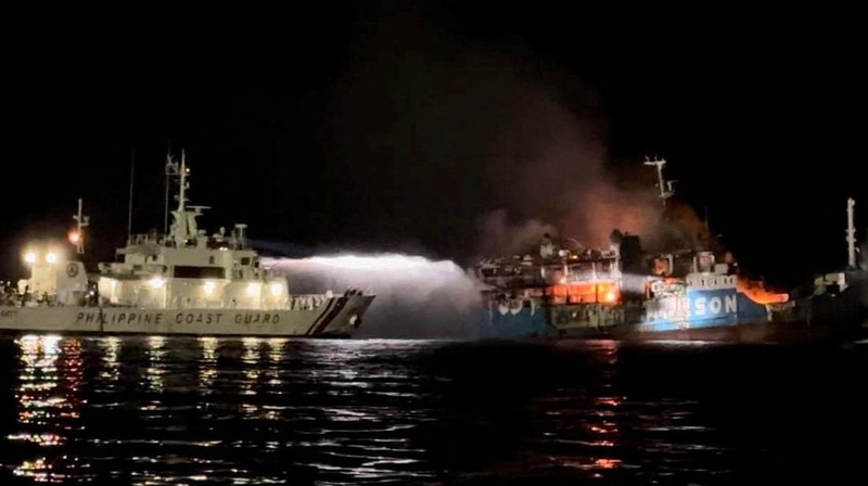 Philippine Coast Guard respond to the fire incident onboard M/V LADY MARY JOY 3 at the waters off Baluk-Baluk Island, Hadji Muhtamad, Basilan, Philippines, March 29, 2023. Philippine Coast Guard/Handout via REUTERS    THIS IMAGE HAS BEEN SUPPLIED BY A THIRD PARTY. NO RESALES. NO ARCHIVES.