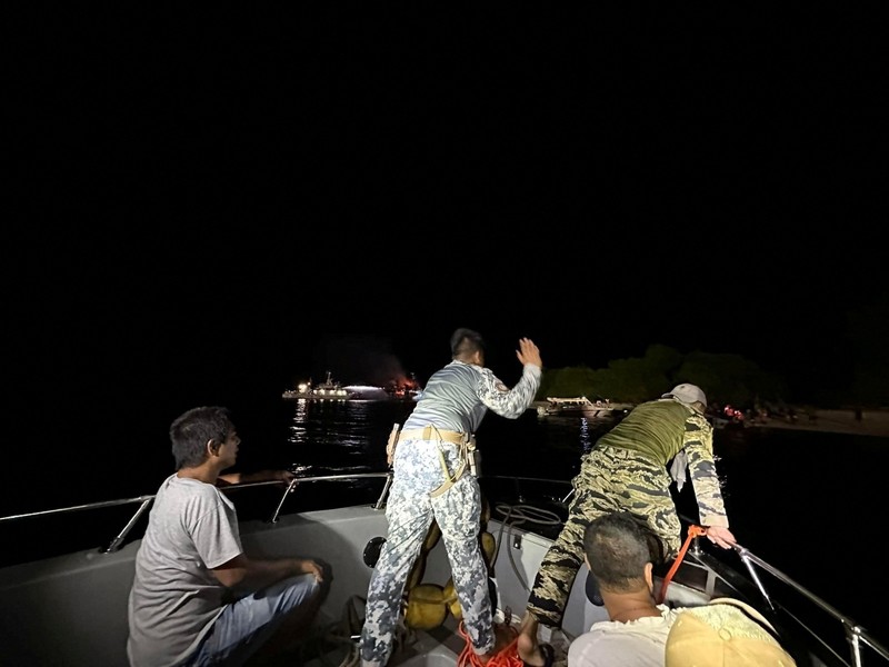 PHLIPPINES-SHIP/ Philippine Coast Guard respond to the fire incident onboard M/V LADY MARY JOY 3 at the waters off Baluk-Baluk Island, Hadji Muhtamad, Basilan, Philippines, March 29, 2023. Philippine Coast Guard/Handout via REUTERS THIS IMAGE HAS BEEN SUPPLIED BY A THIRD PARTY. NO RESALES. NO ARCHIVES.