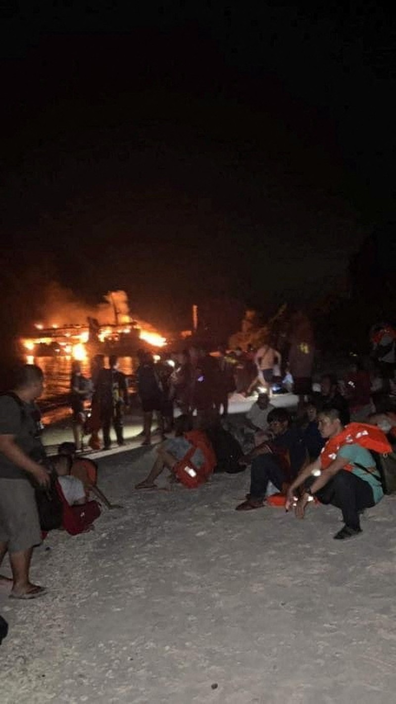 PHLIPPINES-SHIP/ Philippine Coast Guard respond to the fire incident onboard M/V LADY MARY JOY 3 at the waters off Baluk-Baluk Island, Hadji Muhtamad, Basilan, Philippines, March 29, 2023. Philippine Coast Guard/Handout via REUTERS THIS IMAGE HAS BEEN SUPPLIED BY A THIRD PARTY. NO RESALES. NO ARCHIVES.