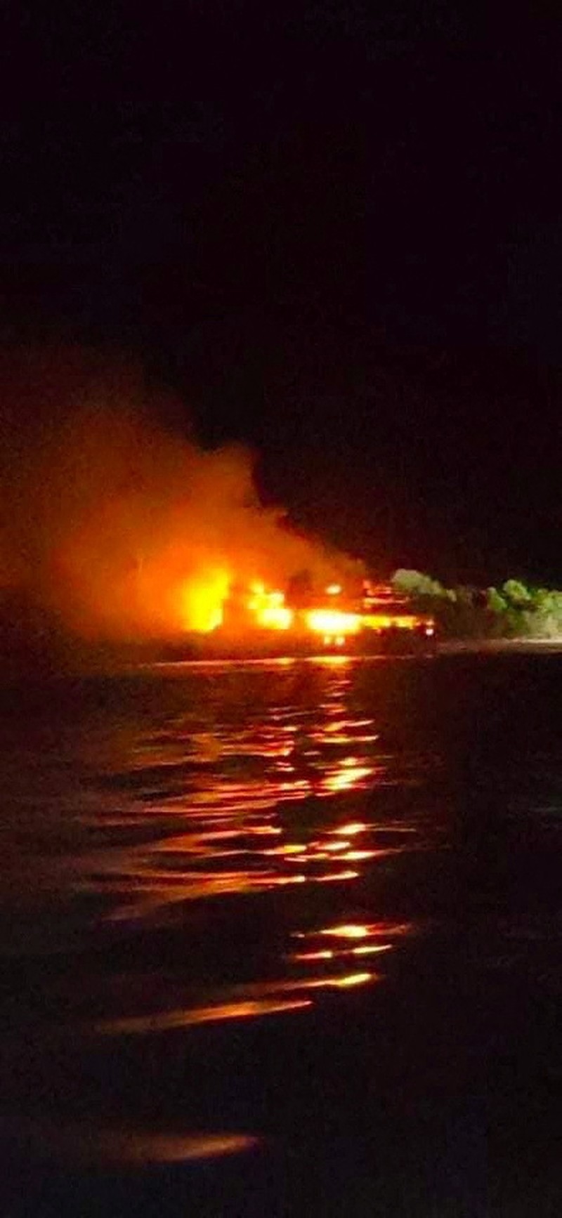 PHLIPPINES-SHIP/ Philippine Coast Guard respond to the fire incident onboard M/V LADY MARY JOY 3 at the waters off Baluk-Baluk Island, Hadji Muhtamad, Basilan, Philippines, March 29, 2023. Philippine Coast Guard/Handout via REUTERS THIS IMAGE HAS BEEN SUPPLIED BY A THIRD PARTY. NO RESALES. NO ARCHIVES.