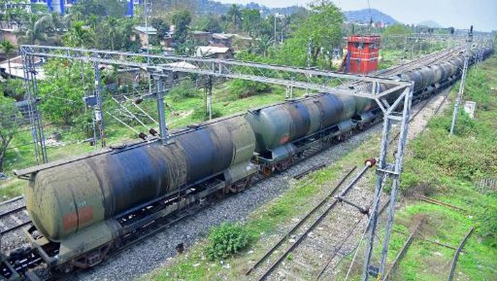An oil tankers train passes near the Guwahati Refinery operated by Indian Oil Corporation, in Guwahati on March 30, 2023. - On March 29 Russian oil giant Rosneft announced a deal with Indian Oil to substantially increase oil supplies to the firm. India has emerged as a major buyer of Russian oil since the Ukraine war. (Photo by Biju BORO / AFP)
