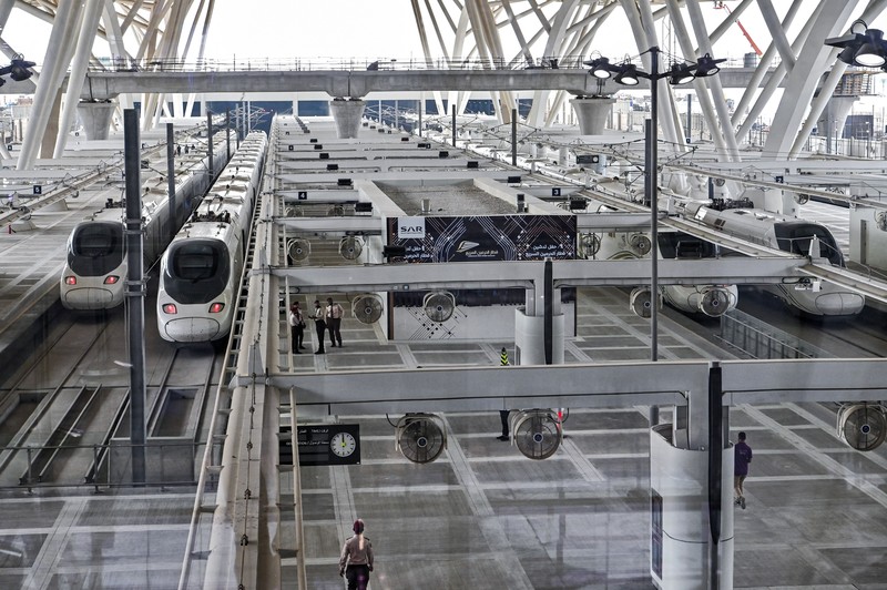 This picture taken on December 12, 2019 shows a view of a Haramain High Speed train, part of a network linking Saudi Arabia's two Muslim holy cities of Mecca and Medina, while at the airport station in the Red Sea city of Jeddah. - The high-speed railway, inaugurated by King Salman in September 2018, runs 450 kilometres (280 miles) via the Red Sea port of Jeddah, shuttling passengers at speeds of up to 300 kilometres per hour. Officials had described it as the biggest transport project in the region. Saudi is boosting its infrastructure spending and expanding its railways as it seeks to diversify its oil-dependent economy. (Photo by GIUSEPPE CACACE / AFP) (Photo by GIUSEPPE CACACE/AFP via Getty Images)
