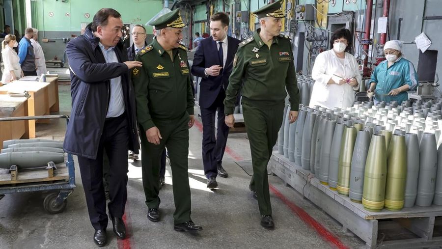 This photo made from video provided by the Russian Defense Ministry Press Service on Wednesday, March 29, 2023, shows Russian Defense Minister Sergei Shoigu, center, visiting defense factories in the Chelyabinsk and Kirov regions producing artillery rounds and rockets. Russian Defense Ministry said that the factories' managers reported on their efforts to modernize industrial assets to boost production. (Russian Defense Ministry Press Service via AP)