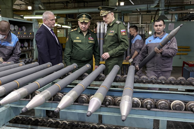This photo made from video provided by the Russian Defense Ministry Press Service on Wednesday, March 29, 2023, shows Russian Defense Minister Sergei Shoigu, center, visiting defense factories in the Chelyabinsk and Kirov regions producing artillery rounds and rockets. Russian Defense Ministry said that the factories' managers reported on their efforts to modernize industrial assets to boost production. (Russian Defense Ministry Press Service via AP)