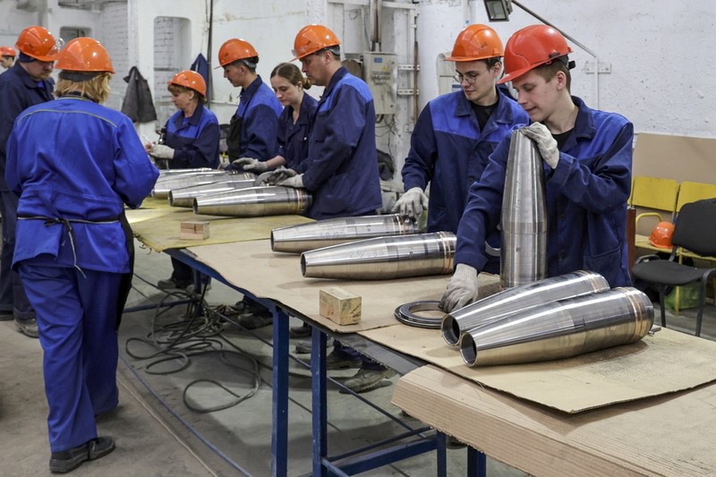 This photo made from video provided by the Russian Defense Ministry Press Service on Wednesday, March 29, 2023, shows Russian Defense Minister Sergei Shoigu, center, visiting defense factories in the Chelyabinsk and Kirov regions producing artillery rounds and rockets. Russian Defense Ministry said that the factories' managers reported on their efforts to modernize industrial assets to boost production. (Russian Defense Ministry Press Service via AP)