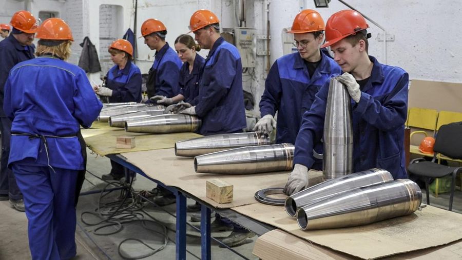 This photo made from video provided by the Russian Defense Ministry Press Service on Wednesday, March 29, 2023, shows Russian Defense Minister Sergei Shoigu, center, visiting defense factories in the Chelyabinsk and Kirov regions producing artillery rounds and rockets. Russian Defense Ministry said that the factories' managers reported on their efforts to modernize industrial assets to boost production. (Russian Defense Ministry Press Service via AP)