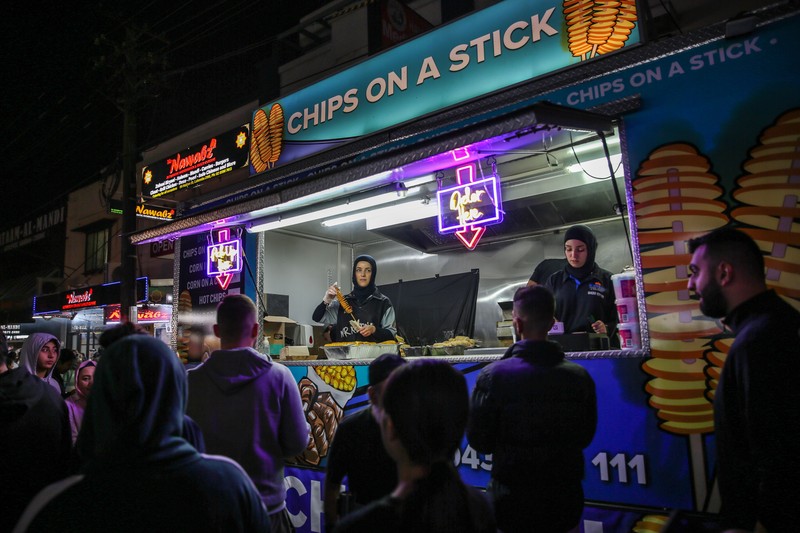 SYDNEY, AUSTRALIA - APRIL 01: People attend the Ramadan Nights food and cultural festival at Lakemba on April 01, 2023 in Sydney, Australia. The holy fasting month of Ramadan is observed by Muslims around the world, including many in Australia, who adhere to its principles in their own suburban communities. (Photo by Roni Bintang/Getty Images)