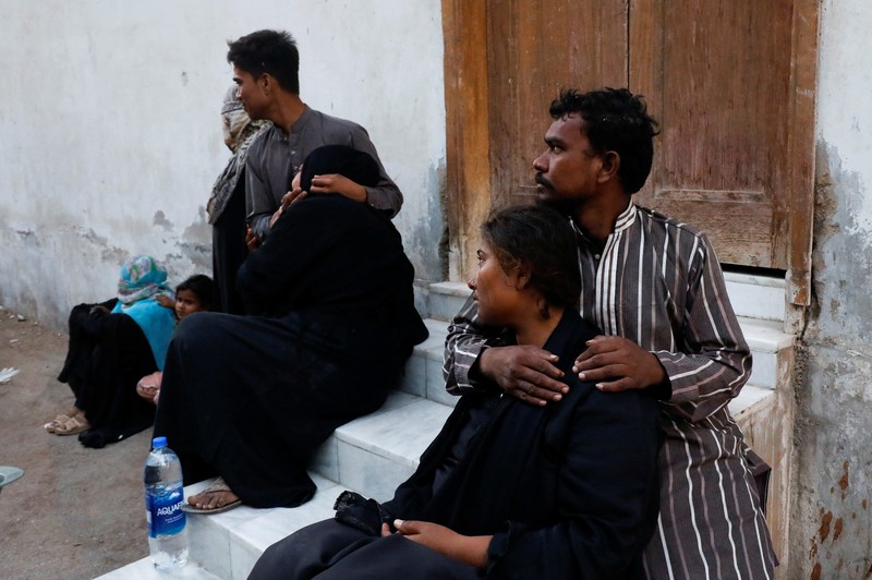 Umer Zada, father of seven year-old Saad Umer, who was killed with others in a stampede during handout distribution, mourns the death of his son during the funeral in Karachi, Pakistan April 1, 2023. REUTERS/Akhtar Soomro