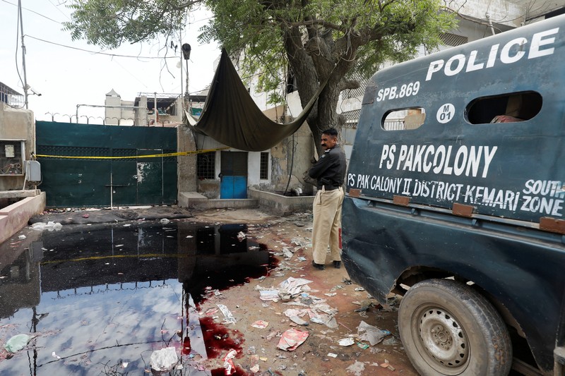 Umer Zada, father of seven year-old Saad Umer, who was killed with others in a stampede during handout distribution, mourns the death of his son during the funeral in Karachi, Pakistan April 1, 2023. REUTERS/Akhtar Soomro