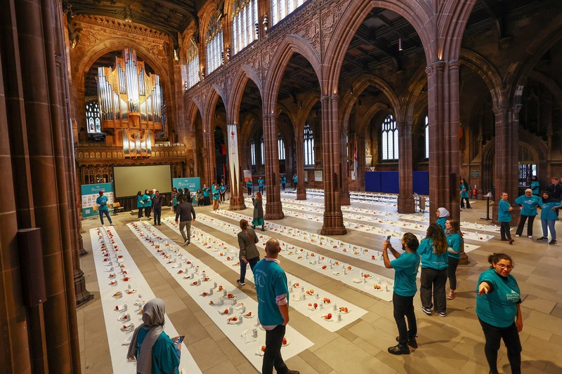 People queue outside Manchester Cathedral for the Iftar (breaking fast) event during the Muslim holy fasting month of Ramadan, in Manchester, Britain, March 29, 2023. REUTERS/Molly Darlington