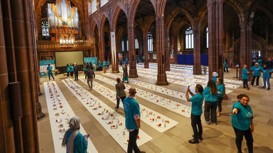People queue outside Manchester Cathedral for the Iftar (breaking fast) event during the Muslim holy fasting month of Ramadan, in Manchester, Britain, March 29, 2023. REUTERS/Molly Darlington