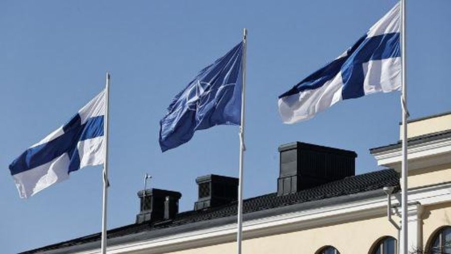 Finnish and Nato flags flutter at the courtyard of the Foreign Ministry in Helsinki, Finland, ahead of accession to the North Atlantic Treaty Organization (NATO) on April 4, 2023. - Finland becomes the 31st member of NATO, in a historic strategic shift provoked by Moscow's war on Ukraine, which doubles the US-led alliance's border with Russia. (Photo by Antti Hmlinen / Lehtikuva / AFP) / Finland OUT