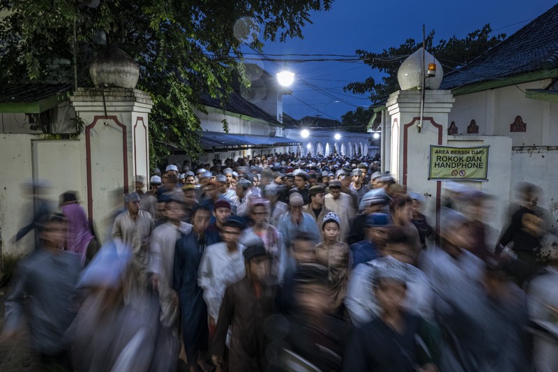 1479132692 MAGETAN, INDONESIA - APRIL 02: Students learn Islamic scriptures in the Islamic boarding school Al-Fatah Temboro during the holy month of Ramadan on April 02, 2023 in Magetan, East Java, Indonesia. Al-Fatah Islamic Boarding School was founded in 1950 by KH. Kholid Umar, also known as Kyai Mahmud. Islamic boarding schools in Indonesia have around 22,000 students, including those from neighboring countries in Southeast Asia, such as Malaysia, Brunei and Thailand. The Al-Falah boarding school occupies a 50-hectare site in Temboro Village, Karas District, Magetan, East Java. It is the largest center for developing the ideology of the Tablighi Jamaat in Southeast Asia. The main goal of the Al-Fatah Islamic Boarding School is to learn about the Prophet, produce religious experts, spread Islam to all walks of life, improve oneself and uphold the da'wah journey of Allah's Apostle. The school's magnitude of the influence of religion on the lives of residents in Temboro has made this area known as the 'Village of Medina'. Students at the Pesantren, also known as