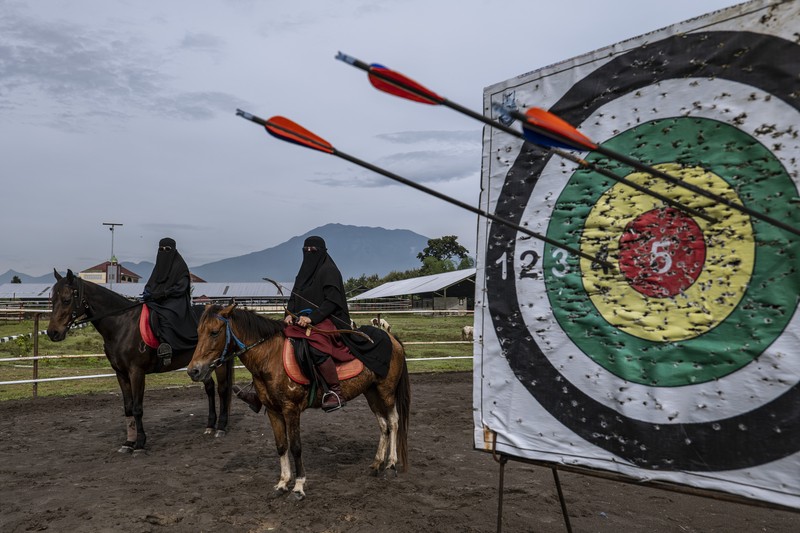 1479132692 MAGETAN, INDONESIA - APRIL 02: Students learn Islamic scriptures in the Islamic boarding school Al-Fatah Temboro during the holy month of Ramadan on April 02, 2023 in Magetan, East Java, Indonesia. Al-Fatah Islamic Boarding School was founded in 1950 by KH. Kholid Umar, also known as Kyai Mahmud. Islamic boarding schools in Indonesia have around 22,000 students, including those from neighboring countries in Southeast Asia, such as Malaysia, Brunei and Thailand. The Al-Falah boarding school occupies a 50-hectare site in Temboro Village, Karas District, Magetan, East Java. It is the largest center for developing the ideology of the Tablighi Jamaat in Southeast Asia. The main goal of the Al-Fatah Islamic Boarding School is to learn about the Prophet, produce religious experts, spread Islam to all walks of life, improve oneself and uphold the da'wah journey of Allah's Apostle. The school's magnitude of the influence of religion on the lives of residents in Temboro has made this area known as the 'Village of Medina'. Students at the Pesantren, also known as