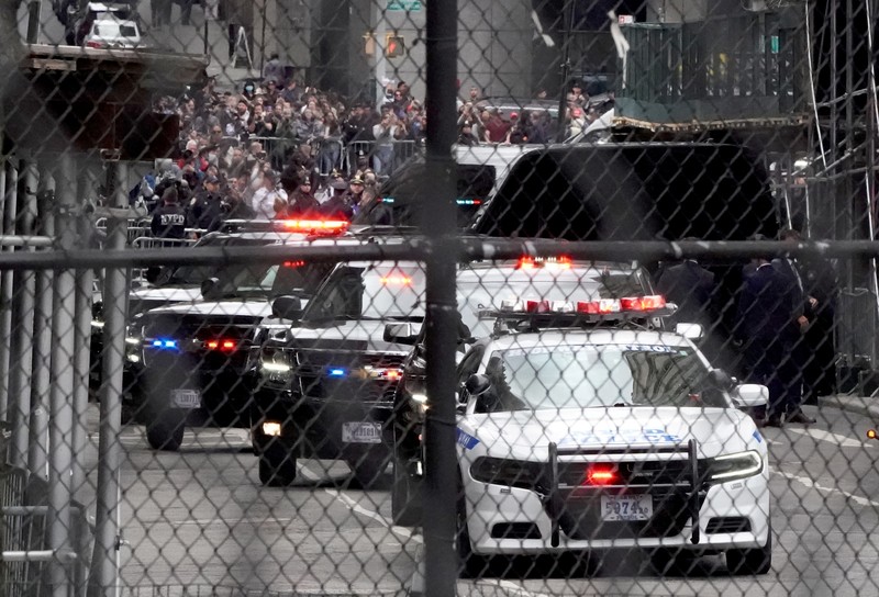 Former U.S. President Donald Trump's motorcade waits at the Manhattan Criminal Courthouse on the day of Trump's court appearance after his indictment by a Manhattan grand jury following a probe into hush money paid to porn star Stormy Daniels, in New York City, U.S., April 4, 2023. REUTERS/Bing Guan