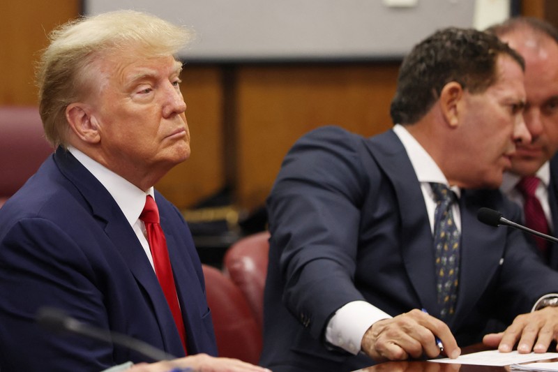 Former U.S. President Donald Trump's motorcade waits at the Manhattan Criminal Courthouse on the day of Trump's court appearance after his indictment by a Manhattan grand jury following a probe into hush money paid to porn star Stormy Daniels, in New York City, U.S., April 4, 2023. REUTERS/Bing Guan