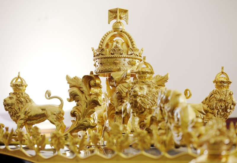 King Charles III Coronation The Diamond Jubilee State Coach on display at the Royal Mews in Buckingham Palace, London, Tuesday April 4, 2023, in which King Charles III and the Queen Consort will travel to the coronation. King Charles III is taking a short cut and smoother ride to Westminster Abbey, trimming the procession route his mother took in 1953 as he aims for a more modest coronation that will include some modern touches, Buckingham Palace said Sunday April 9, 2023. (Yui Mok/PA via AP)