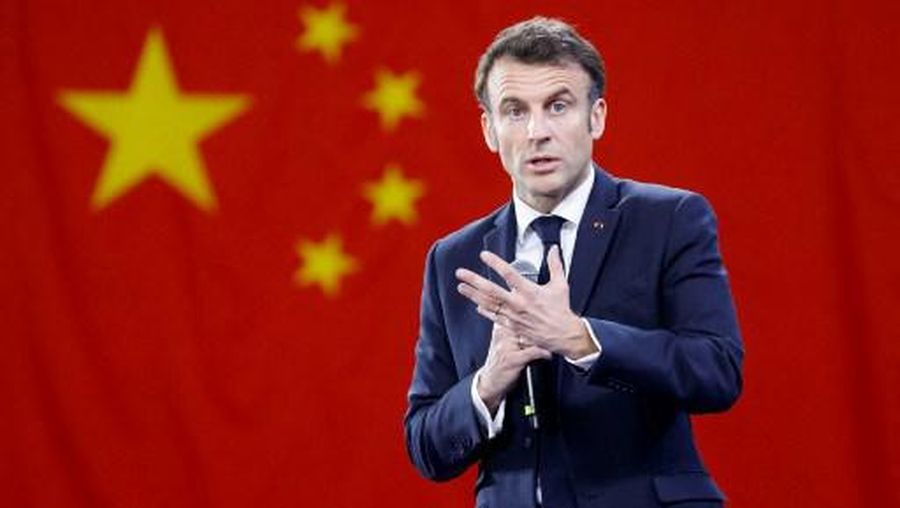 French President Emmanuel Macron gestures as he speaks to students at Sun Yat-sen University in Guangzhou on April 7, 2023. (Photo by LUDOVIC MARIN / AFP)