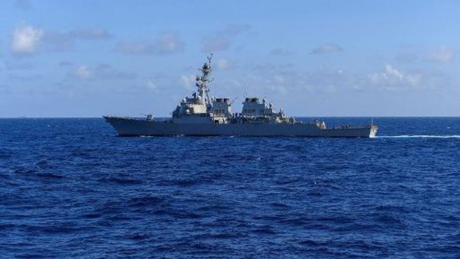 This handout photo from the US Navy taken on November 20, 2021 shows the US Navy's Arleigh Burke-class guided-missile destroyer USS Milius (DDG 69) sailing in the South China Sea. - China simulated 
