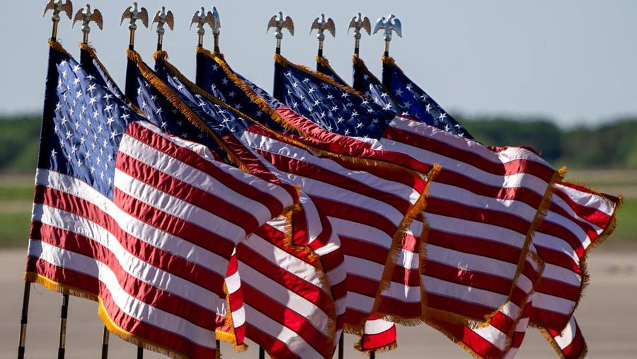 US flags are seen at former US President Donald Trump's 2024 election campaign rally in Waco, Texas, March 25, 2023. - Trump held the rally  at the site of the deadly 1993 standoff between an anti-government cult and federal agents. (Photo by SUZANNE CORDEIRO / AFP) (Photo by SUZANNE CORDEIRO/AFP via Getty Images)