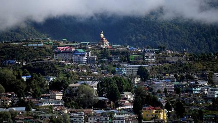 A Buddha statue is pictured in Tawang near the Line of Actual Control (LAC), neighbouring China, in India's Arunachal Pradesh state on October 21, 2021. (Photo by Money SHARMA / AFP)