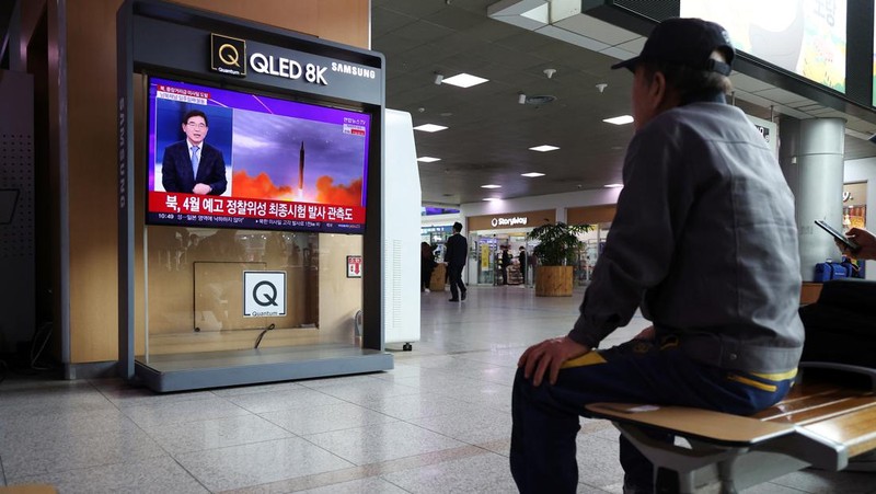 A TV screen displays a warning message called 