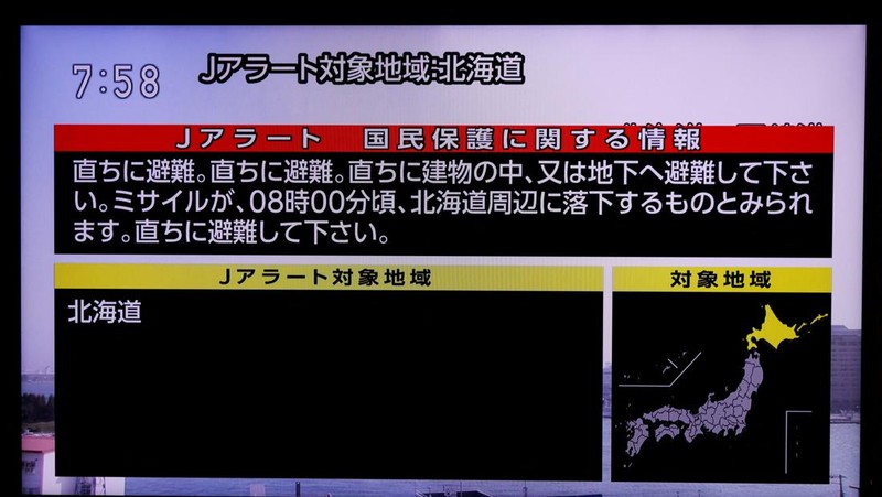 A TV screen displays a warning message called 