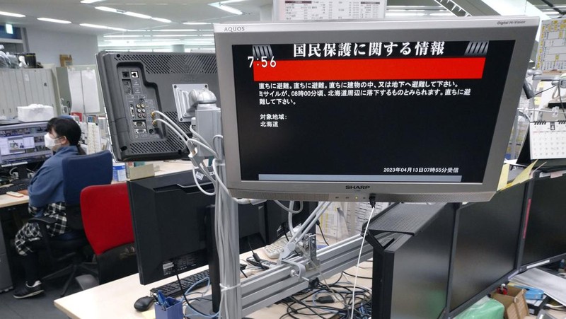A TV screen displays a warning message called 