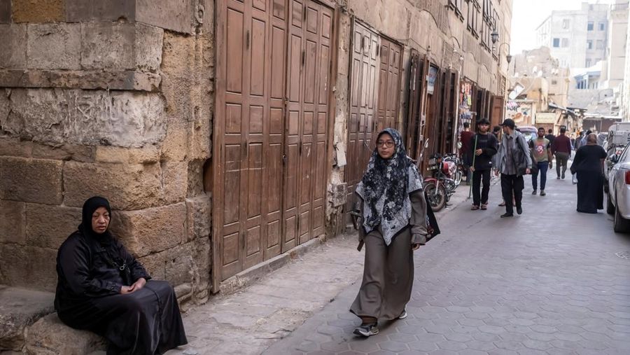 Indonesian student Nuni Nuraini Ahyani, 25, leaves the house to give a lesson on Hadith for new students during the holy month of Ramadan, after her day studying Usul al-Din with a specialization in Hadith at Al-Azhar University in old Islamic Cairo, Egypt April 4, 2023. REUTERS/Fatma Fahmy
