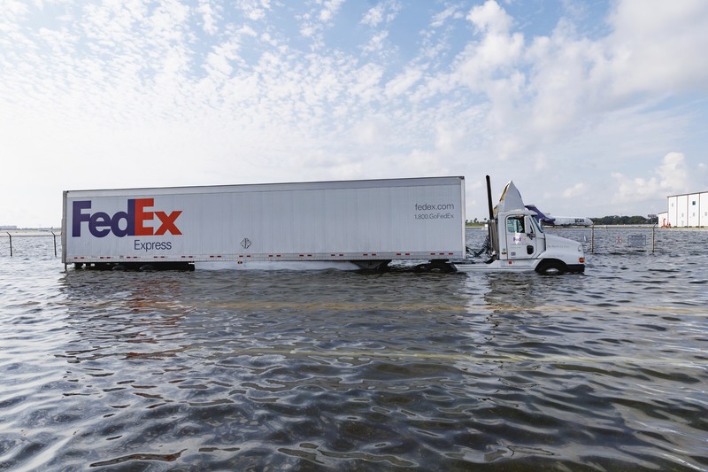 Private jets parked next to traffic control towers as the runway remains flooded from heavy rain at Fort Lauderdale-Hollywood International Airport on Thursday, April 13, 2023. (David Santiago/Miami Herald via AP)