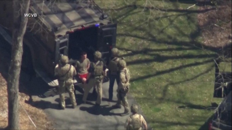 FBI agents arrest Jack Teixeira, an employee of the U.S. Air Force National Guard, in connection with an investigation into the leaks online of classified U.S. documents, outside a residence in this still image taken from video in North Dighton, Massachusetts, U.S., April 13, 2023. WCVB-TV via ABC via REUTERS. ATTENTION EDITORS - NO SALES NO ARCHIVES THIS IMAGE HAS BEEN SUPPLIED BY A THIRD PARTY MANDATORY CREDIT